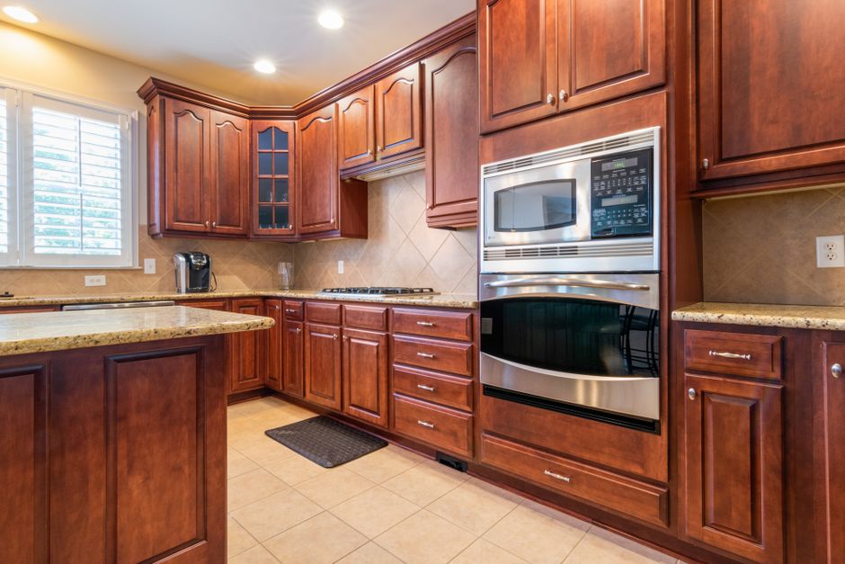 Close-up of clean tile floor with sealed grout lines in a home kitchen